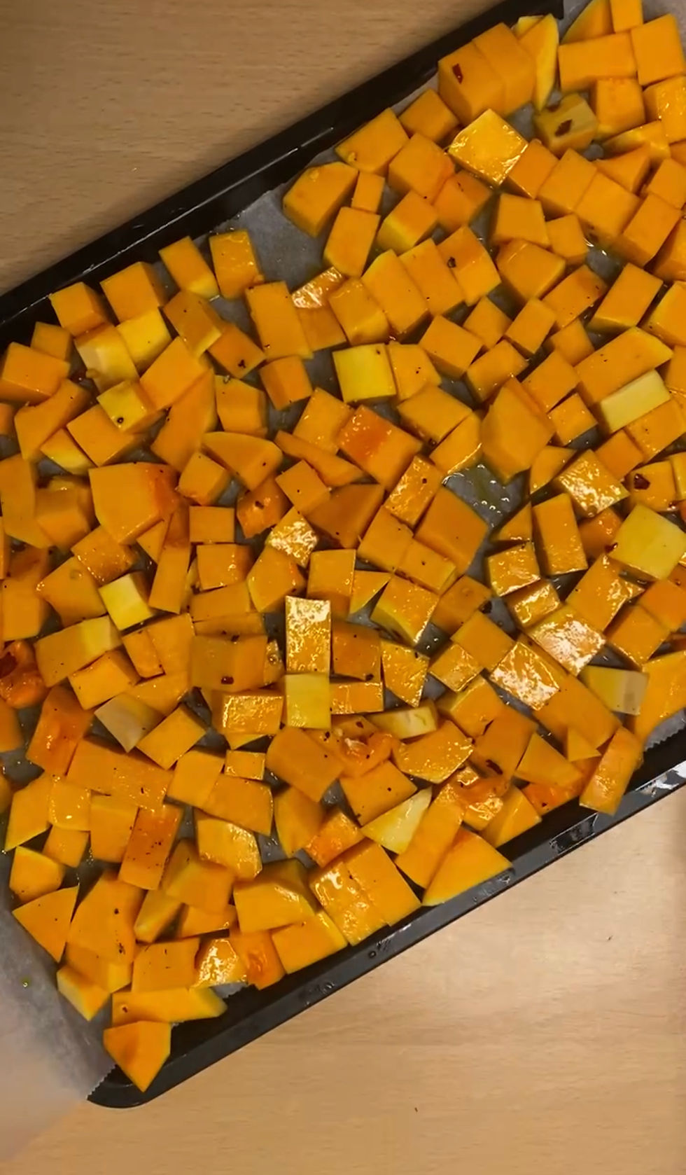 Butternut Squash Cubes on a baking tray with olive oil