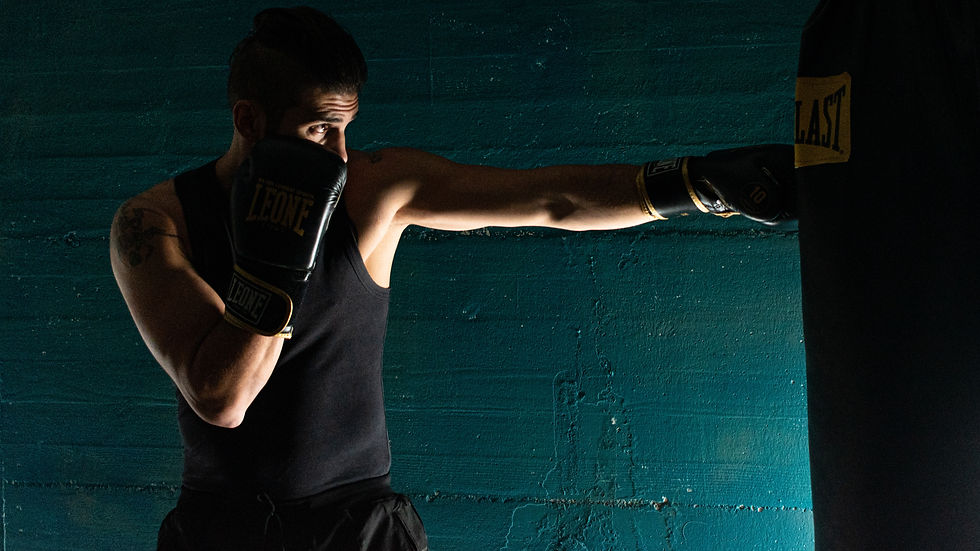 an athlete punching a punch bag with high focus
