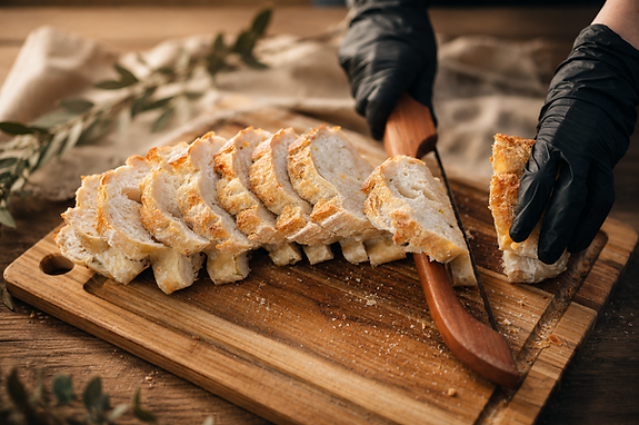 palm and proof original artisan sourdough loaf being sliced at a farmers market in fort lauderdale