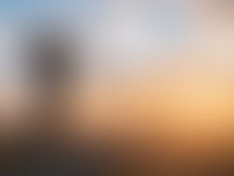 A woman at the top of a mountain