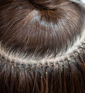 Hot hair extensions on micro capsules. Italian hair extension technology. Hair extensions