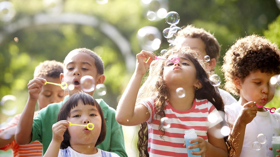 Children playing bubbles