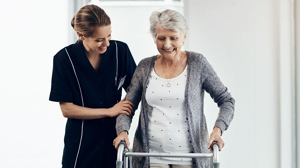 A physical therapist helps a Parkinson's patient.