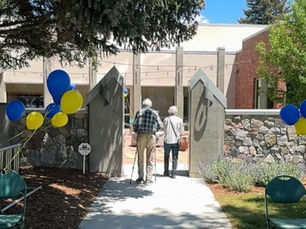 An elderly couple walks into the Blue Skies Nursing Yampa Valley Memory Cafe