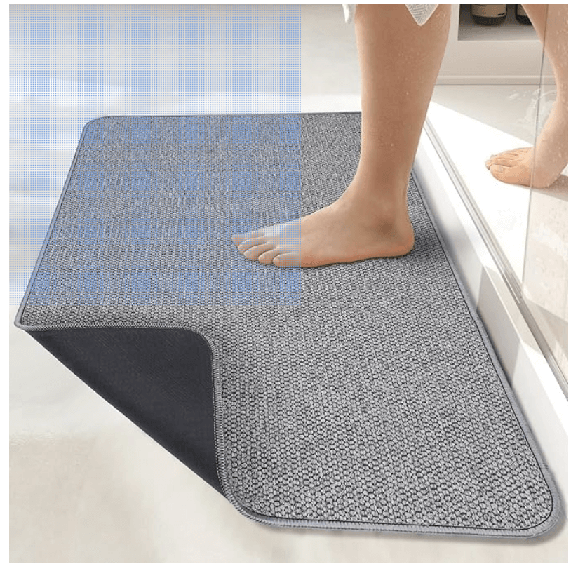 A person steps on a non-slip bathmat.