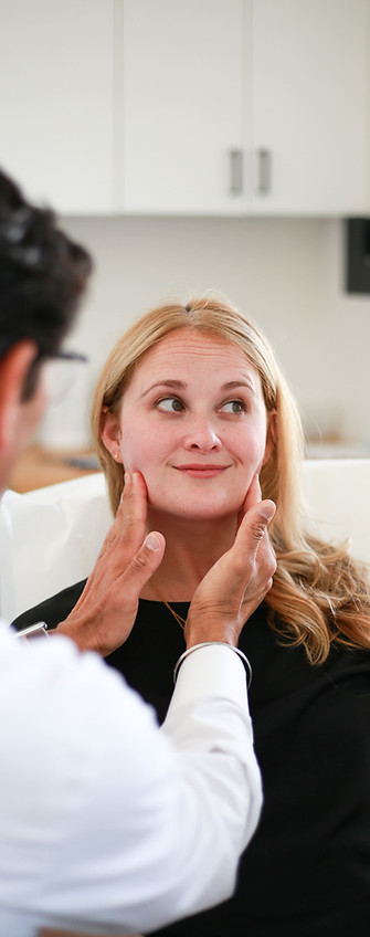 dr-a-examines-patients-jaw (2).jpg