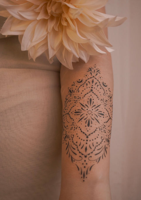 ornamental scar cover tattoo