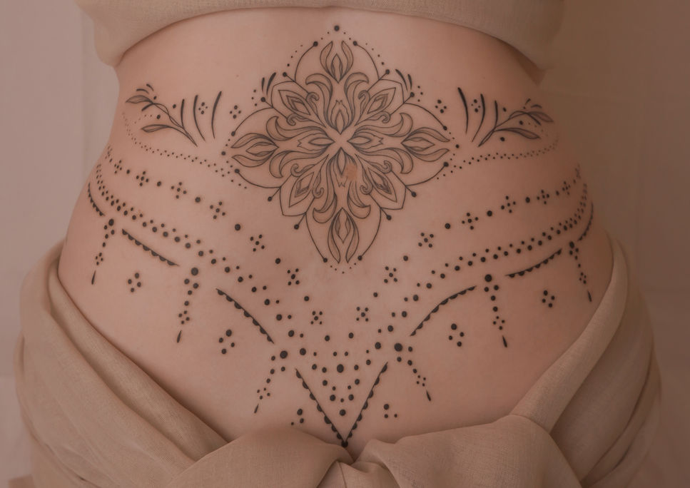 elegant hip ornamental tattoo with mandala center, perfect body flow