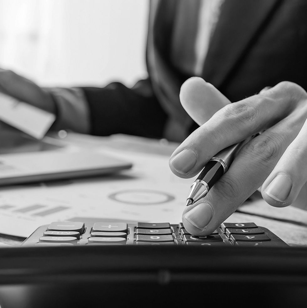 close-up-businessman-using-calculator-and-laptop-f-2026-01-07-00-50-51-utc copy.jpg