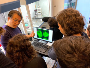 Myeong-Je Cho, Ph.D., Director and PI of Plant Genomics and Transformation Facility, shows some cool science to students
