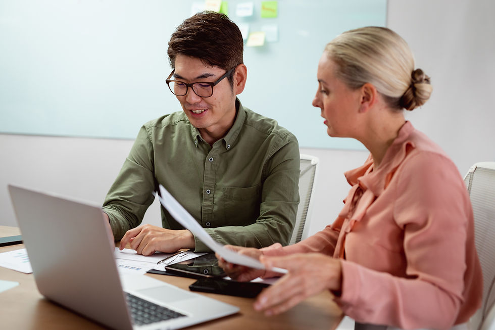 diverse-male-and-female-colleague-sitting-at-table-2025-04-05-05-20-47-utc.jpg