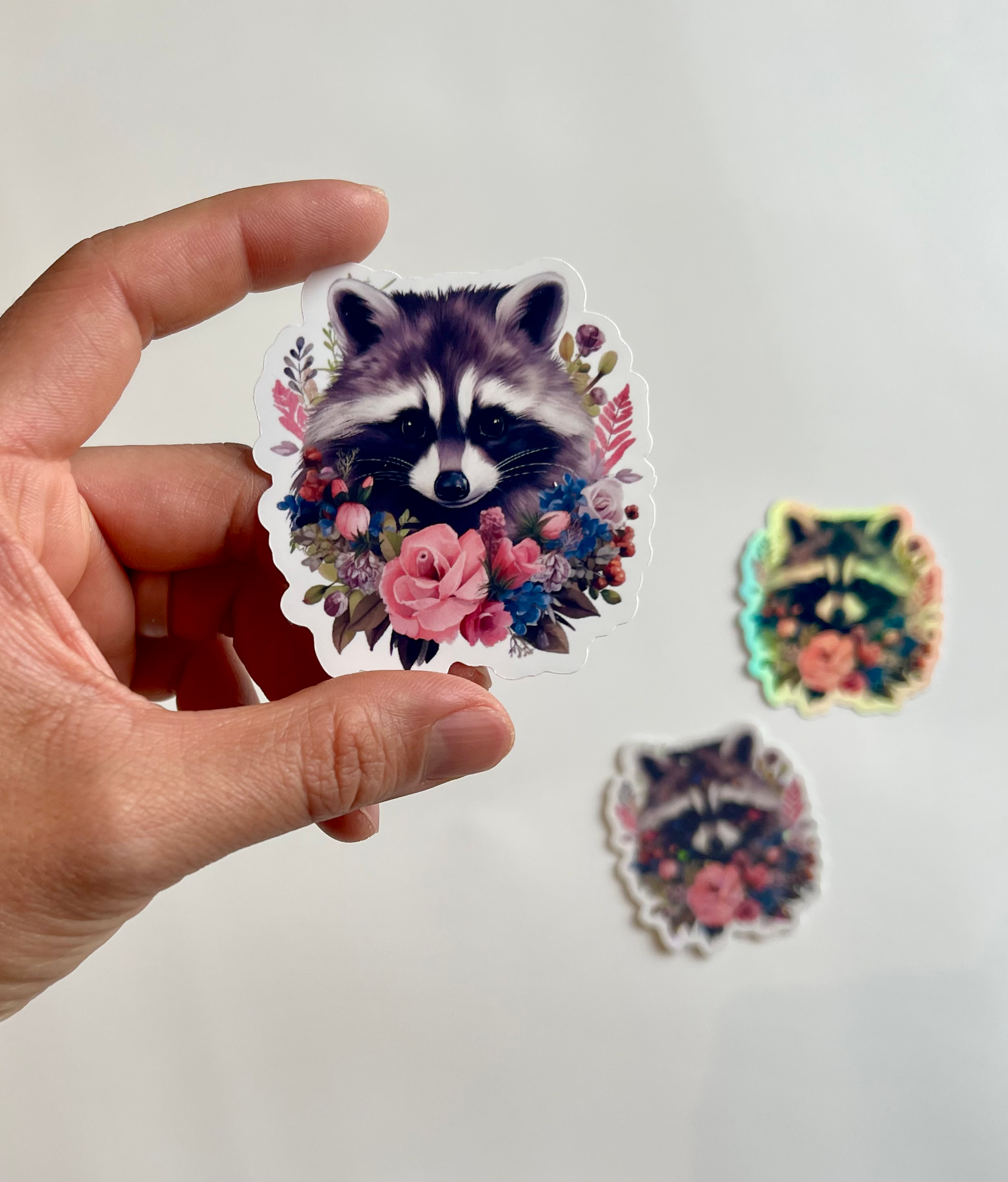 Cute Raccoon With Pink Floral Foliage โ Aesthetic Nature Sticker