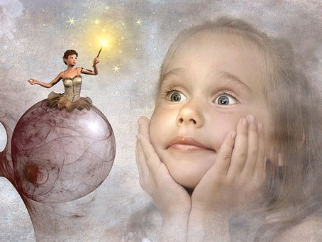 Child looking at fairy