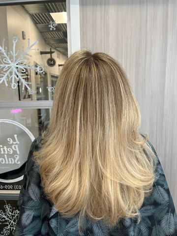 Sun-Kissed Long Blonde Balayage Long hair with sunny blonde balayage.