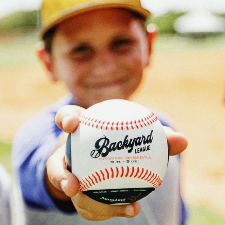 playfinity_backyard-league_boy-with-gaming-baseball.webp