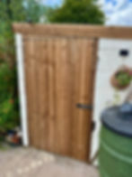 New wooden garden gates installed with secure finish
