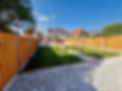 Professionally landscaped garden with patio and lawn