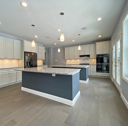 Kitchen with double island and 2 oven wall