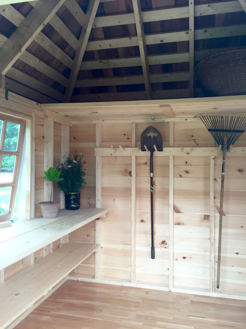Custom-built potting shed, designed for gardening enthusiasts, featuring ample space for planting and storage with a durable and attractive design