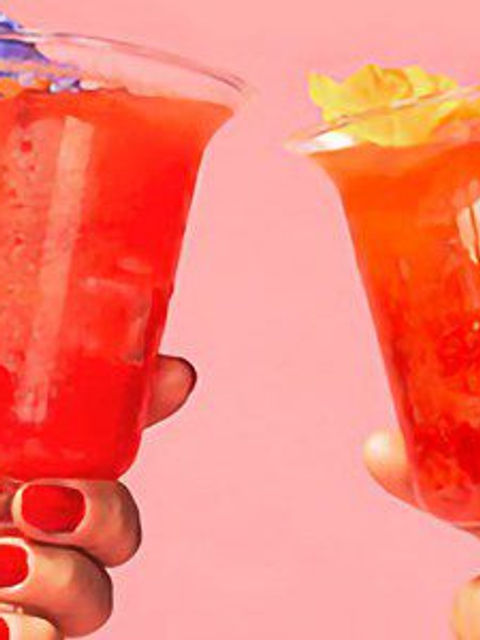 Two Hands Toasting with Cocktail Glasses