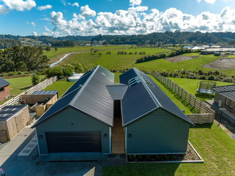 Aerial view of residential buildings with newly installed metal roofing