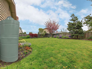 Slimline rainwater tank beside a modern New Zealand home
