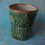 Miniatura: zielony ceramiczny kubek z kamienicami