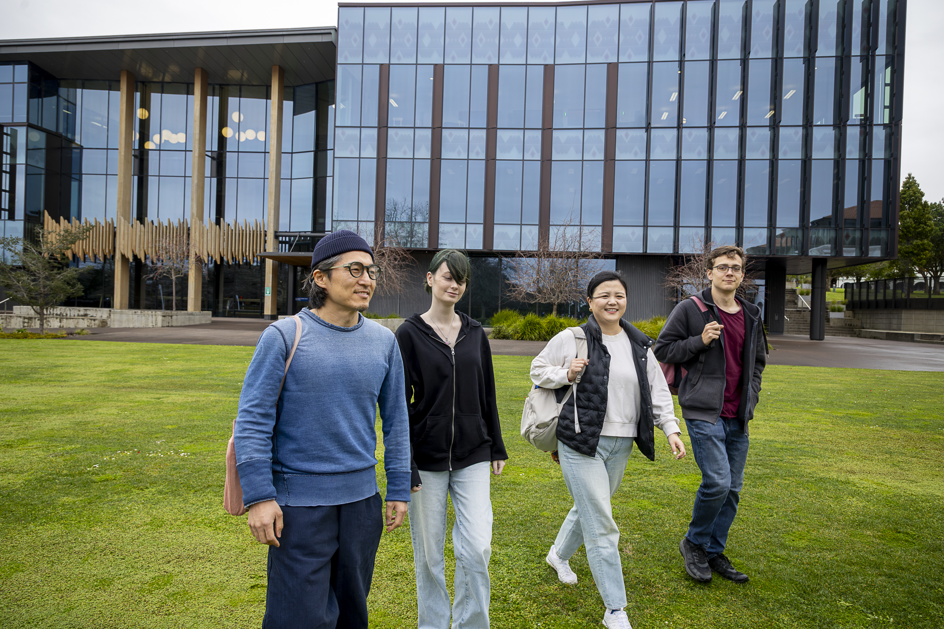 students-walking-outside-campus-building.jpg