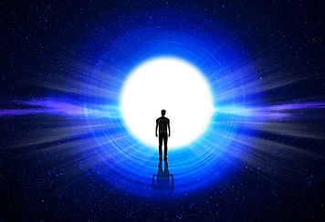 Man silhouette at the end of the tunnel with the universe and blinding light in the backgr