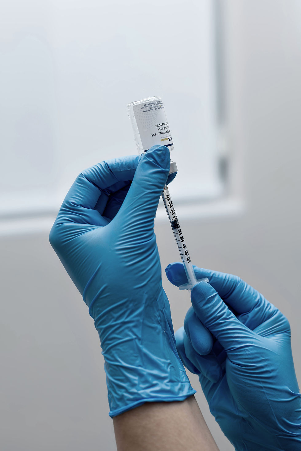 Medical aesthetics provider preparing an injectable treatment for personalized aesthetic care in Bluffton, SC.