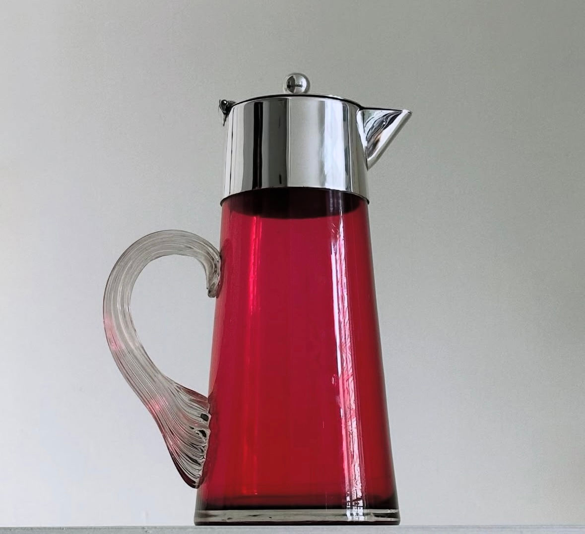A Tall Victorian Cranberry Glass and Silver Plated Lidded Pitcher, c.1890