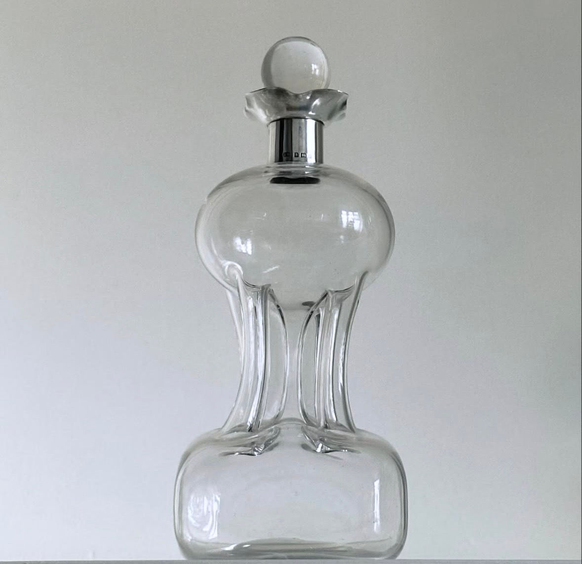An Edwardian Clear Glass and Silver Glug Glug Decanter by Thomas Woolley, c.1905