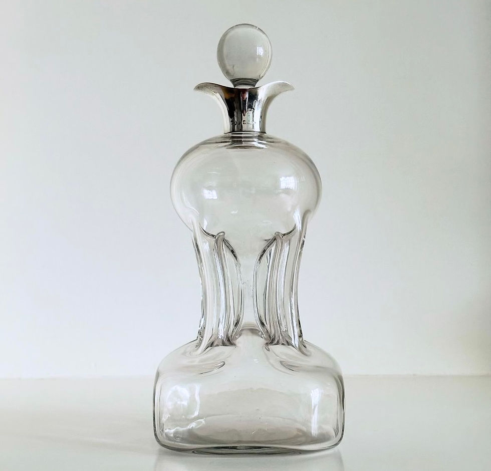 Thumbnail: A Deco Glass and Silver Glug Glug Decanter by Hukin & Heath, c.1927
