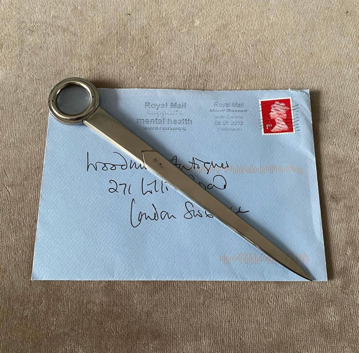 An Early 20th Century Deco Magnifying Glass and Letter Opener