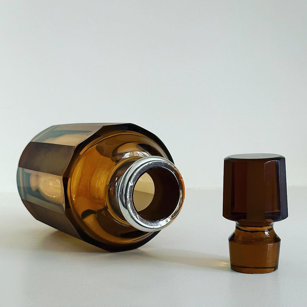 Thumbnail: A Faceted Amber Glass and Silver Decanter, c.1920
