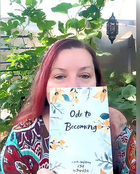 me holding ode to becoming_edited.jpg