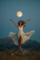 woman dancing under the full moon symbolizing being seen taking up space