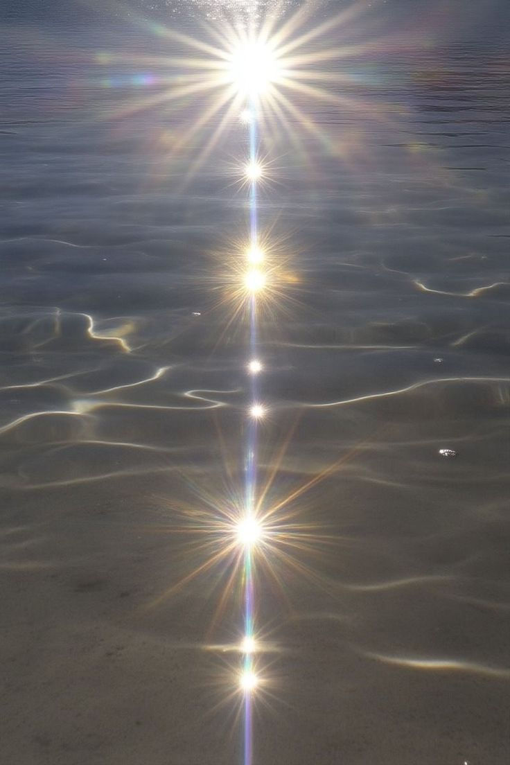 light reflecting off of water symbolizing moving from pisces season to aries season
