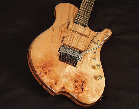 raadotar 6-string electric guitar - masterbuilt - custom wooden pickup covers - ambrosia maple top and back wood - graph tech ghost lb63 piezo-loaded floating tremolo - hipshot grip-lock locking tuners - custom kitara suomesta - made in finland - bare knuckle pickups ragnarok set