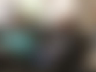 Two women laughing on a couch