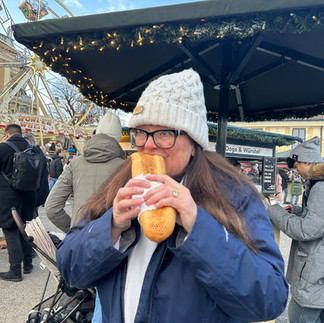 Melissa Meredith Fail enjoying a sausage at Schonbrunn Palace Christmas Market