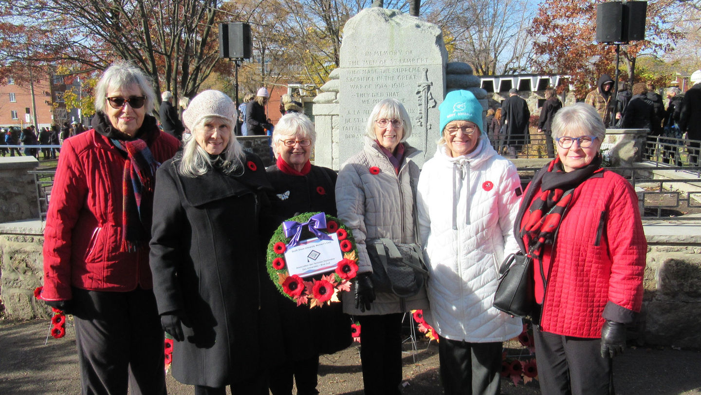 A photo of members of the CFUW MSS with a wreath that was placed at the Remembrance Day ceremonies in Saint Lambert in November 2024.