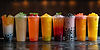 vecteezy_colorful-bubble-tea-drinks-with-boba-pearls-on-a-black_46874171 (1).jpeg