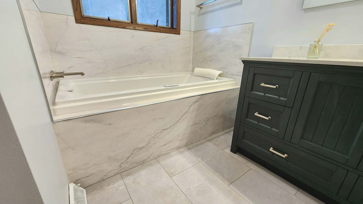 Crafted Shower Systems can be used as a tub surround, shown in Azurra Bay with complimenting classic blue vanity