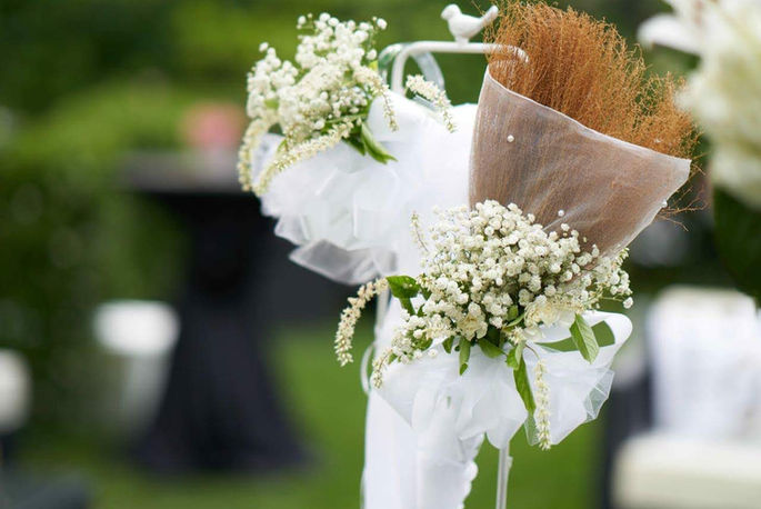 baby's breath and little  henry  sweetspire, white tulle & ribbon  Glo D. Enterprises