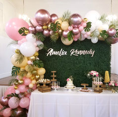 Grass backdrop, balloon arch, custom sign, boxwood artificial grass wall, balloon garland