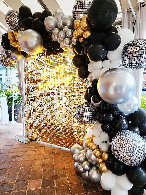 Gold backdrop, balloon garland, HAPPY BIRTHDAY neon sign party rentals