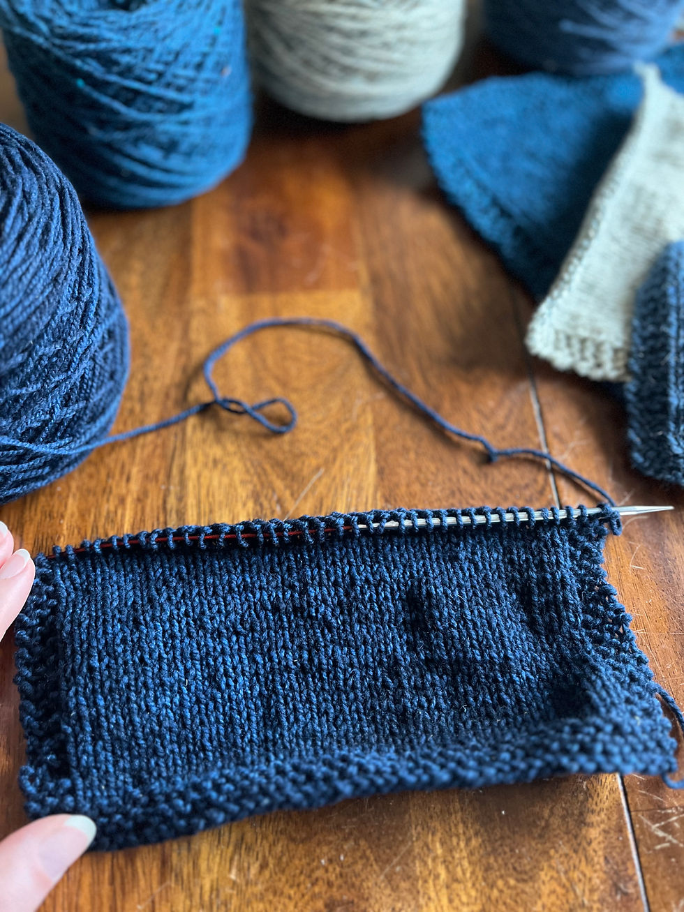 Knitted wool swatches on a table during a yarn tasting