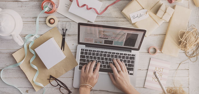 A person typing on the laptop.