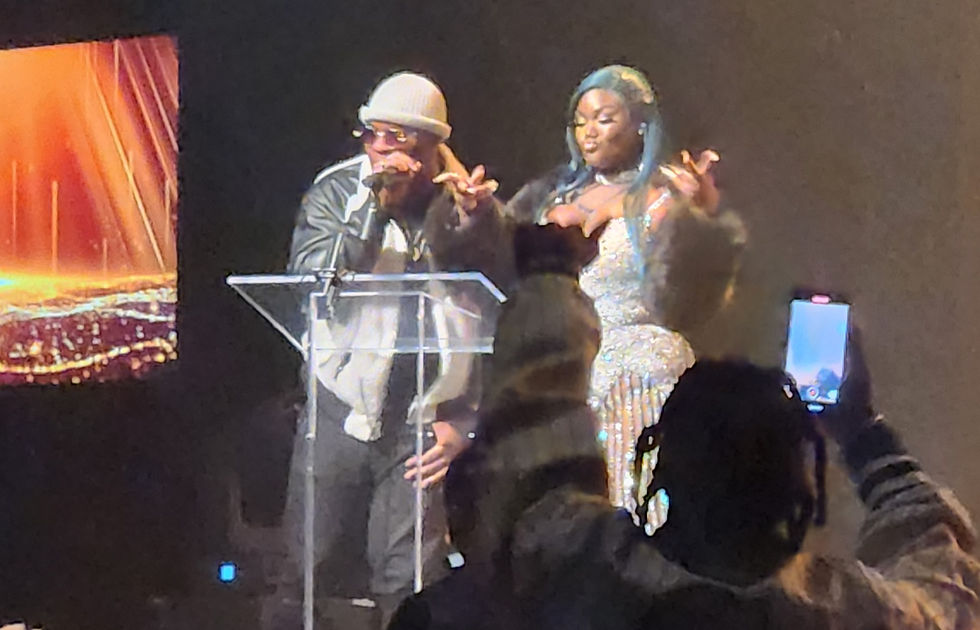Feezy presenting an award